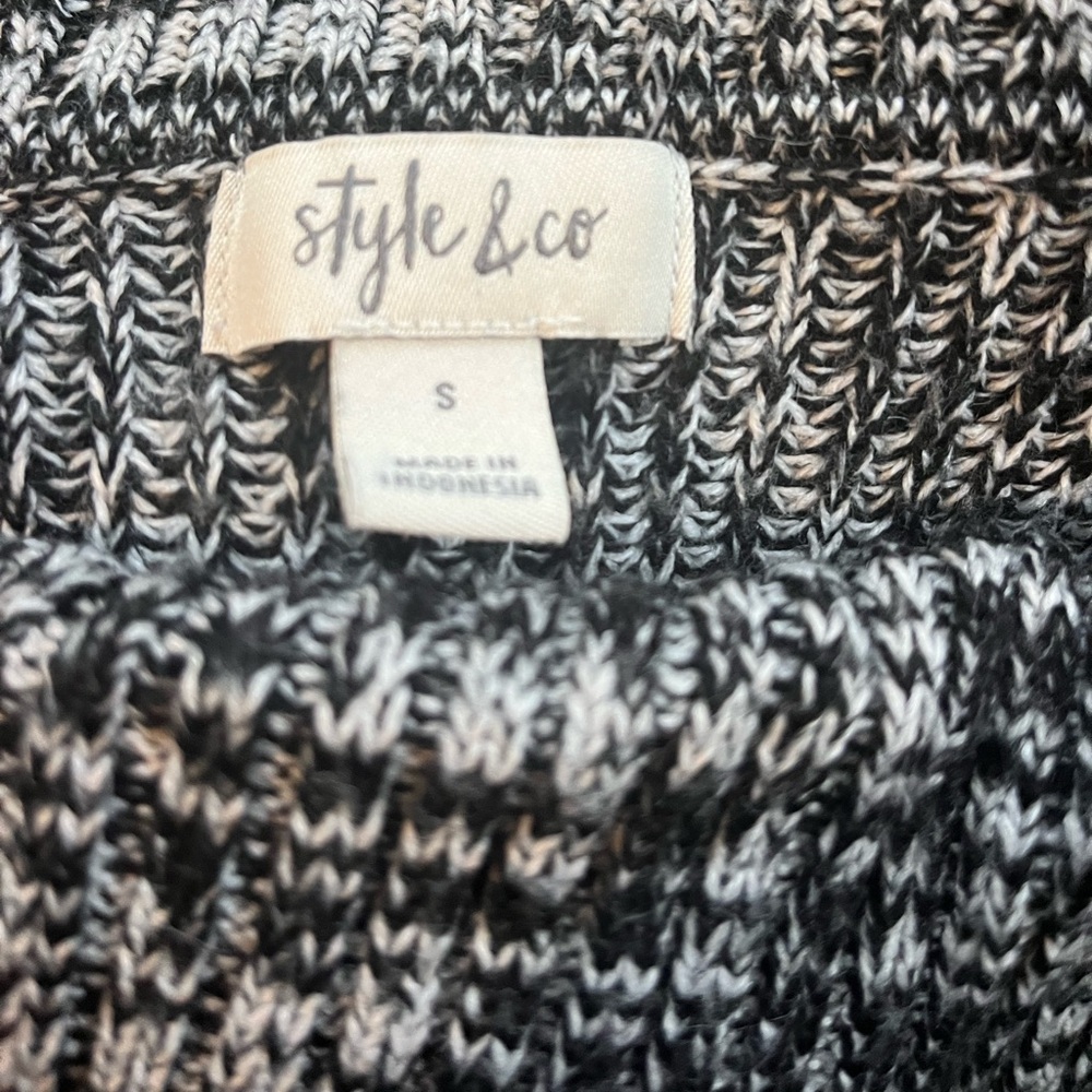 Asymmetrical black and white sweater